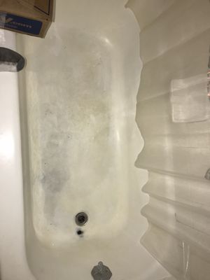 Bathtub before. Very think w scum/grime.