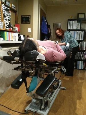 Chiropractor adjusting a patient.