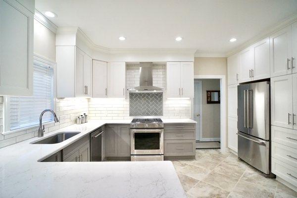 Bright kitchen remodel with full wall of built-ins. So much work space with a U shaped countertop.