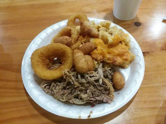 Giant bbq plate with onion rings, mac n cheese, and hush puppies