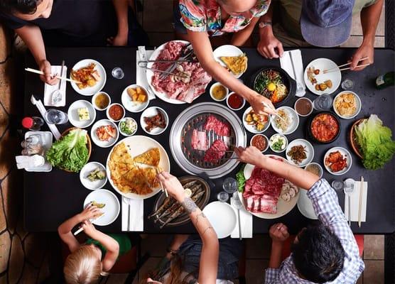 A family enjoying Korean BBQ at Seorabol Korean Restaurant, where SRB Events was born.