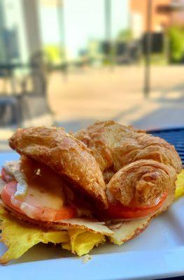 Turkey, brie, tomato, and fig compote on a freshly baked croissant, $10. Awesome!