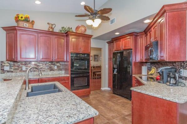 Beautiful wood cabinetry and granite counters.