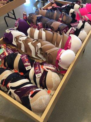 The store keeps clearance bras on a big table