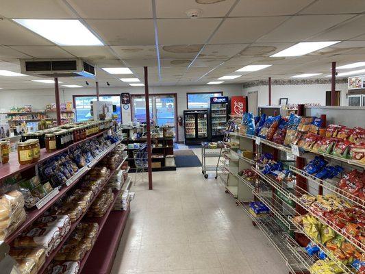 a view of the inside of the store, facing away from the deli and towards the front entrance