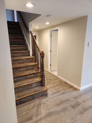 Basement flood damage. Wall finishing and painting. LifeProof flooring. Baseboard trim.