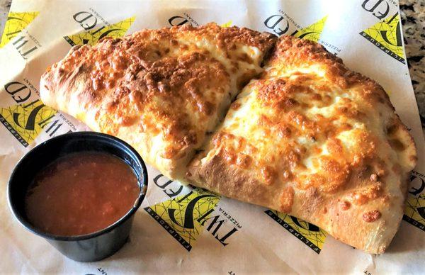 Pepperoni Sizzler Calzone: pepperoni, capicola, hot peppers, onions, cheddar, and mozzarella cheese