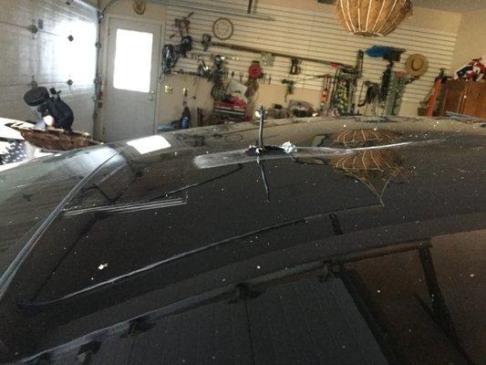 This is my car roof after I tore the fin off with the garage door.  Lots of deep scratches, torn metal and dents.