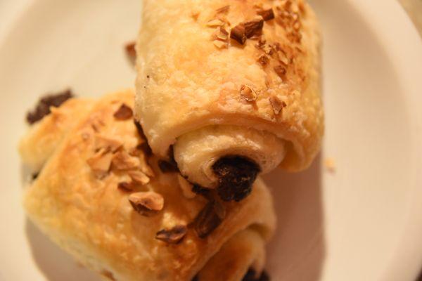 Sourdough chocolate croissants topped with chopped almonds