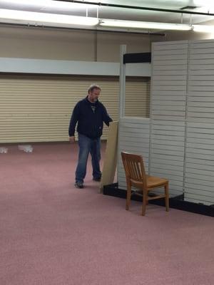 Tom building the shelves.