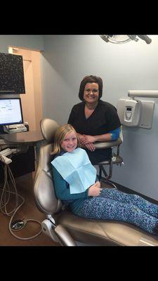 Assistant Jen Sandman with a patient.