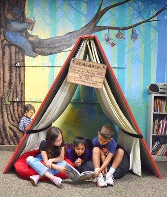 Reading in the library.