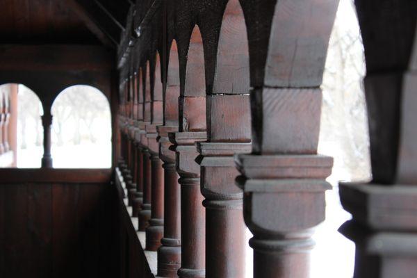 A photograph of the Moorhead Stave Church ambulatory arches.