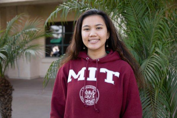 Class of 2019 senior wearing her MIT sweatshirt after receiving early acceptance.