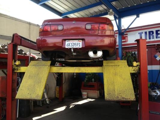 Acura Integra that Tech's assistant was working on. Installing a new muffler