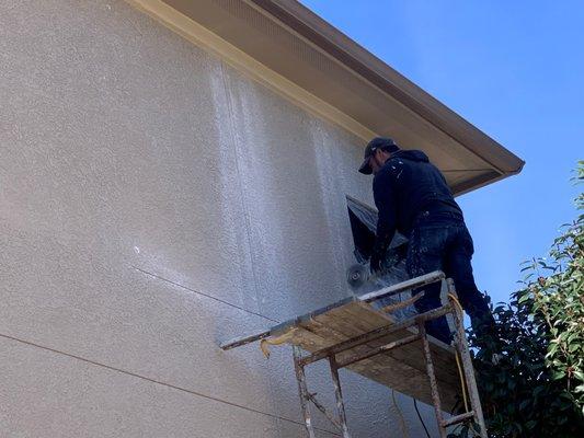 cutting stucco to put in windows (before)