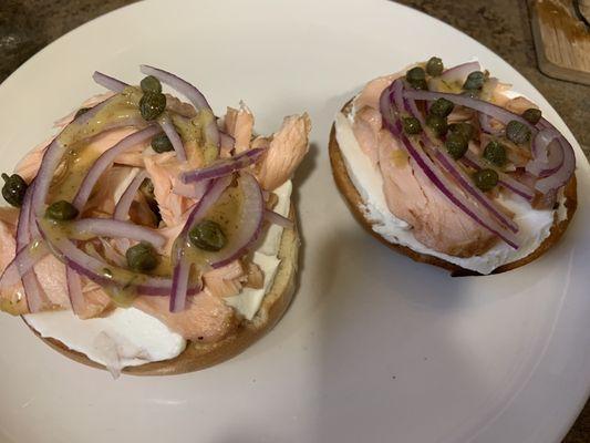 Fish Brothers smoked salmon on toasted bagel with locally-made larrupin, red onion, and capers