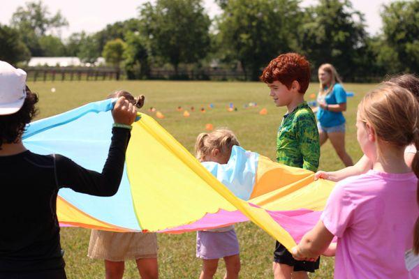 Kids playing outdoors during our vacation bible school