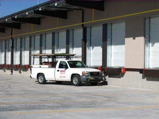 Overhead garage roll up doors and dock equipment