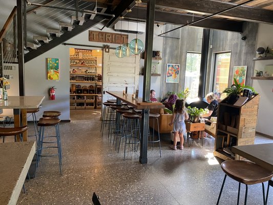 Indoor seating with the store in the background