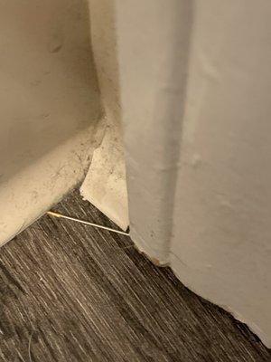 Needle on bathroom floor