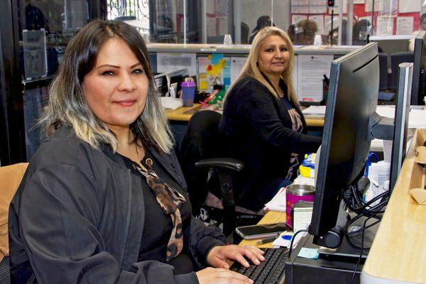 IILA's front desk staff at our corporate headquarters helping create a welcoming environment. Photo credit: High Caliber Images.