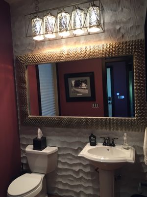 very eye catching 3 dimension tile, awesome mirror and great lighting