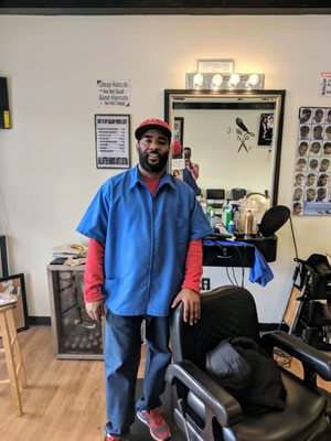 Shop owner and head barber, Antonio