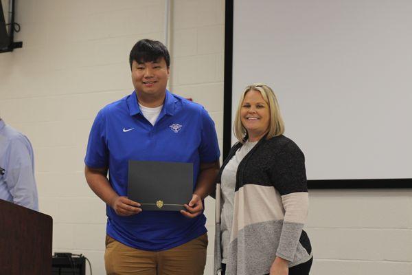 Mason P w/our CEO Jessica Higdon, one of our scholarship winners. 2023