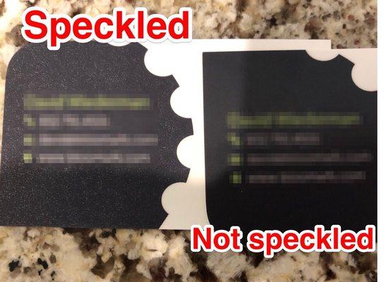 The laminate or the color is speckled, either way it's wrong compared to the right