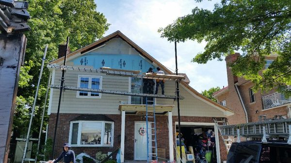 New roof, extended gable, new windows and siding