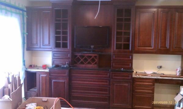 Kitchen Remodel Job buffet section with multiple depth cabinets with crown arround uppers