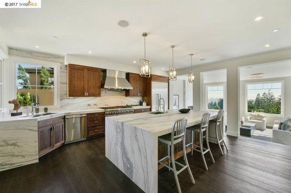 Kitchen: Full overlay, frameless Walnut Cabinetry with a clear conversion varnish "satin" sheen finish.