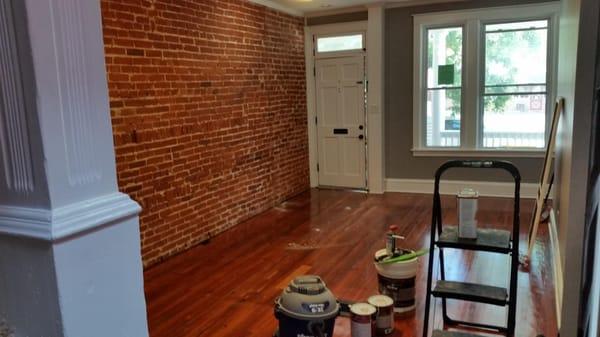 This is an after picture of a wall that we exposed the brick on