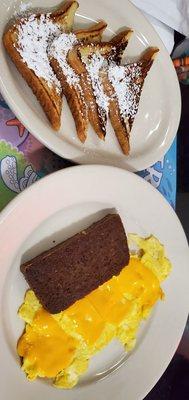 Discounted breakfast of French toast, scrambled eggs with cheddar, and scrapple.