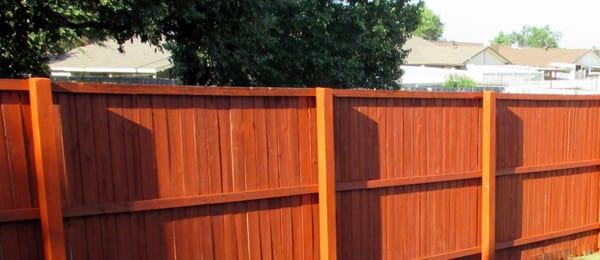 The fence they repaired for us. Replaced 10 posts, power washed, and stained the fence. Practically looks like a new fence.