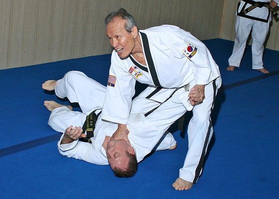 Grandmaster Choon Lee demonstrating a technique during class