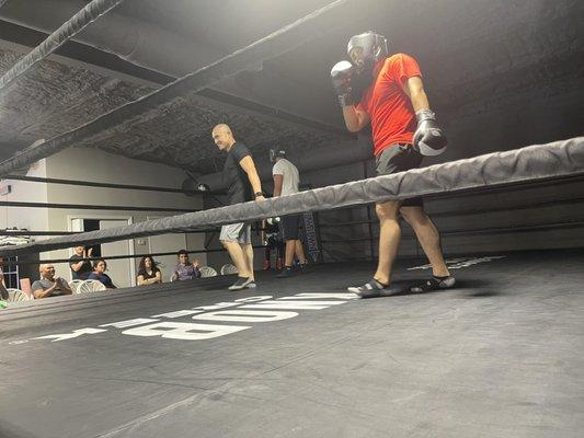 A fighter and our favorite announcer, moments before  a sparring match at our Father's Day Event.