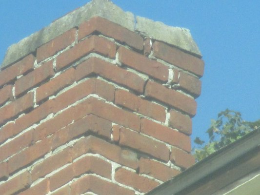 Deteriorated chimney, making this repair can be costly.