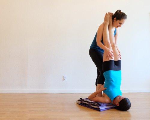 Heather with a student in shoulderstand