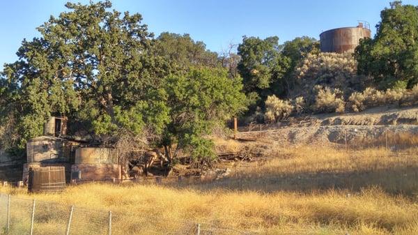 The boilers and the tank up on the hill.