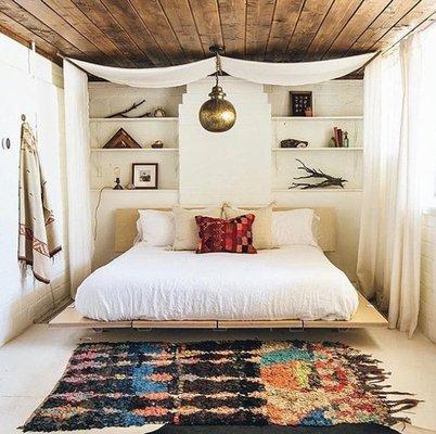 We are drooling over this bedroom design! Obsessed with that fixture and rug, of course!