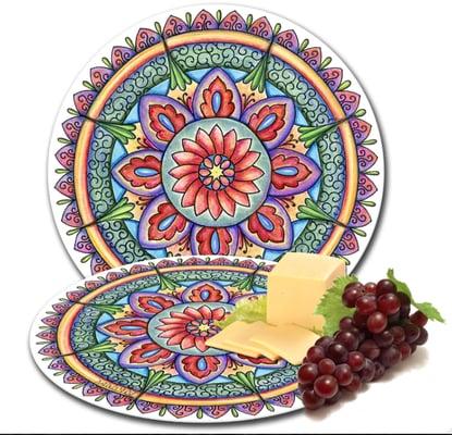 Versatile tempered glass cutting board/serving tray. 12" diameter. Available in several mandala designs. $40