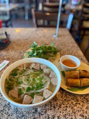 P9. Meatballs Noodle Soup and half order of A3. Egg Rolls