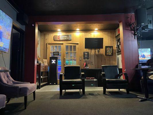 Part of the lounge with the humidor behind the double doors.