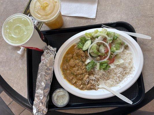 Curry chicken, rice, salad and naan bread