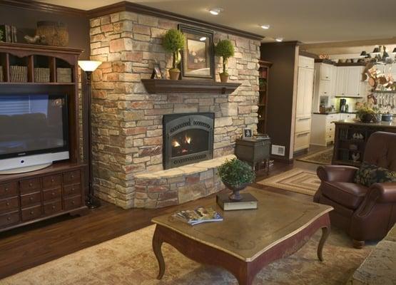 basement remodel with stone fireplace