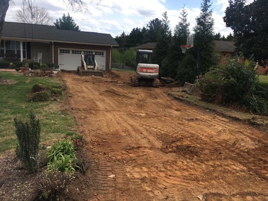 Tear out old concrete driveway