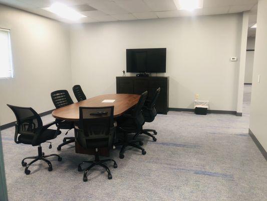 The tv in our newly renovated meeting room is hung where Wild Horse closed in the previously existing opening in the wall.