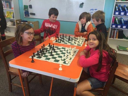 Elementary students take extracurriculars such as chess, Latin, Chinese, art, computer programming, and more.